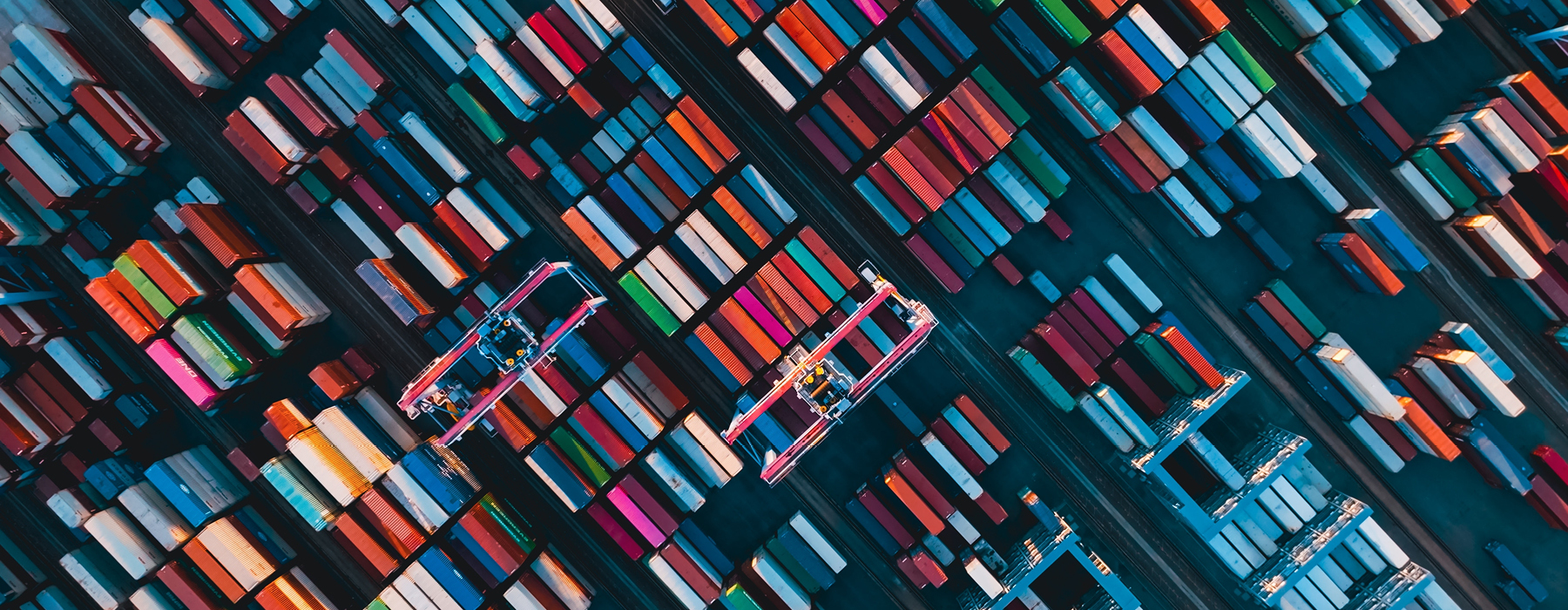 Birds eye view of hundreds of shipping containers of different colours. 